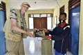 6319 Jan gives book to village office_00001.jpg